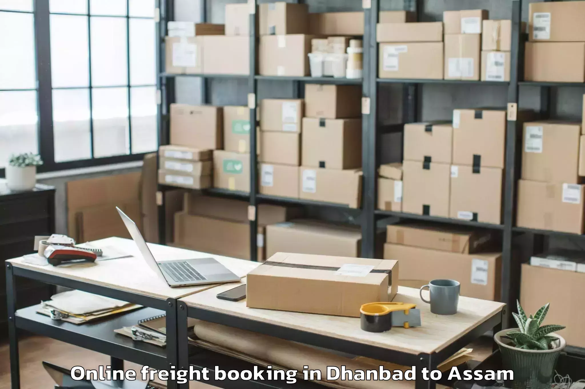 Dhanbad to Marigaon Online Freight Booking Booking